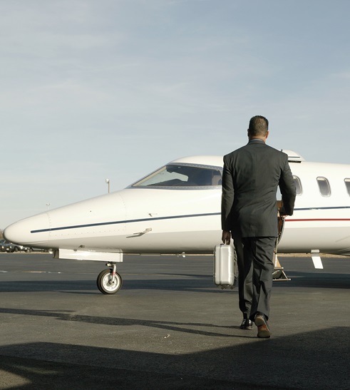 Businessman boarding airplane